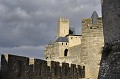 Carcassonne: le château comtal avec sa tour de guet et les remparts sous un ciel menaçant. aude,pays cathare,carcassonne,chateau comtal,tour de guet 